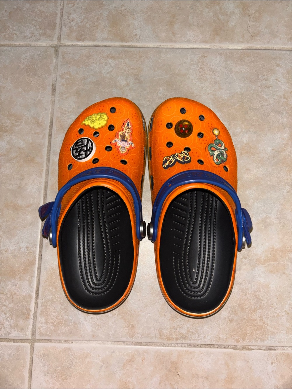 CROCS Orange Clog Slippers with Blue Heel Strap